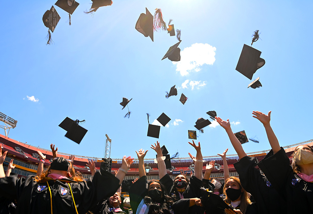 Graduates of the Catholic University of America celebrate during the school's 132nd annual commencement ceremony at FedExField May 15, 2021, in Landover, Maryland. (CNS/Courtesy of the Catholic University of America) Graduates of the Catholic University of America celebrate during the school's 132nd annual commencement ceremony at FedExField May 15, 2021, in Landover, Maryland. (CNS/Courtesy of the Catholic University of America)