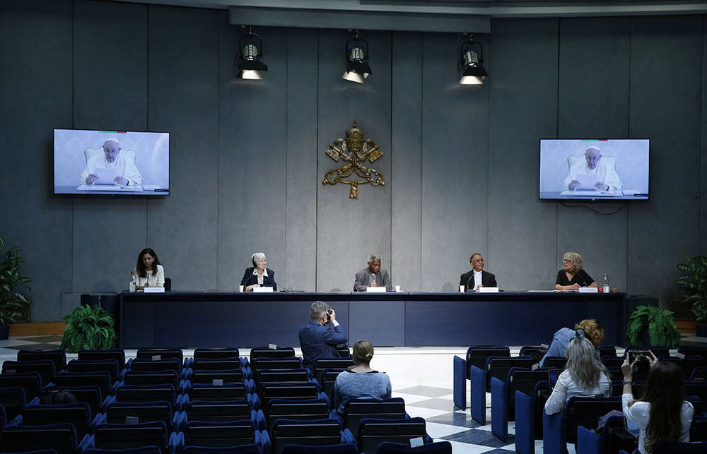 Pope Francis delivers a recorded video message during a news conference to unveil a new platform for action based on his 2015 encyclical, Laudato Si', at the Vatican May 25. (CNS/Paul Haring)
