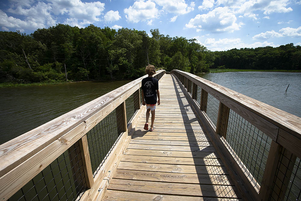 A boy explores Mattawoman Creek at Smallwood State Park in Marbury, Maryland, May 23. (CNS/Tyler Orsburn)