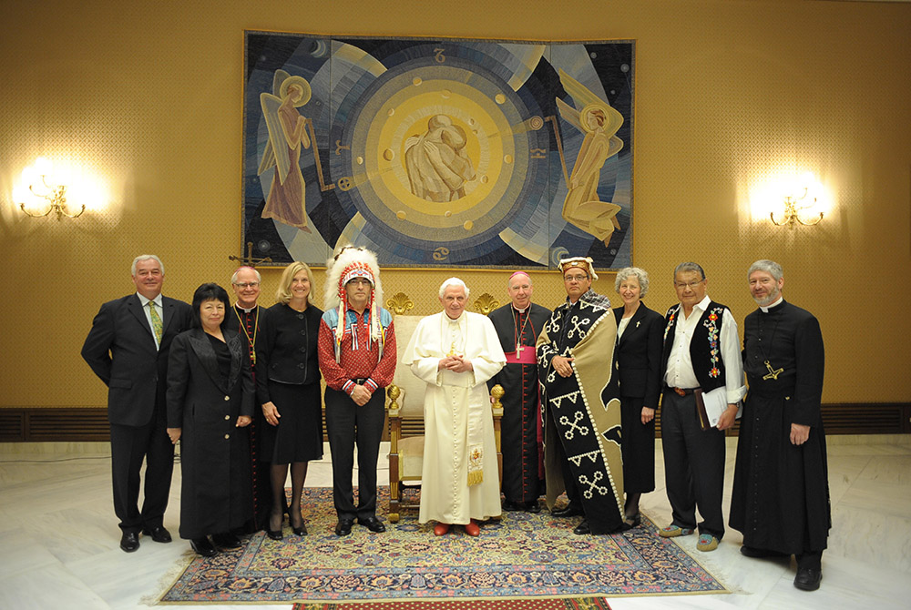 Pope Benedict XVI poses with representatives of students at the former Indian residential schools and the church in Canada at the Vatican April 29, 2009. (CNS/L'Osservatore Romano)