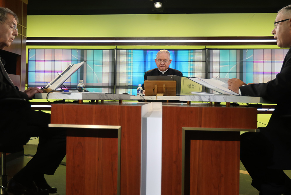 Msgr. Jeffrey Burrill, general secretary of the U.S. Conference of Catholic Bishops, right, reads a message to Pope Francis June 16, at the bishops' conference headquarters in Washington on the opening day of the bishops' three-day virtual spring meeting. Msgr. Jeffrey Burrill, general secretary of the U.S. Conference of Catholic Bishops, right, reads a message to Pope Francis June 16, at the bishops' conference headquarters in Washington on the opening day of the bishops' three-day virtual spring meeting.