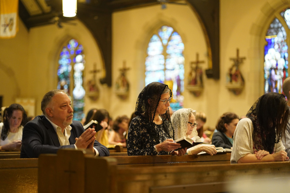 Worshippers attend a traditional Latin Mass July 18 at St. Josaphat Church in the Queens borough of New York City. The parish, located in the Diocese of Brooklyn, celebrates a traditional Latin Mass on Sundays and five other days of the week. (CNS)
