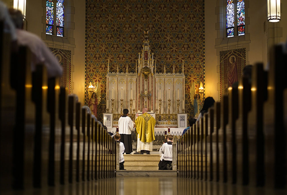 Fr. Stephen Saffron, parish administrator, prays during a traditional Latin Mass July 18 at St. Josaphat Church in the Queens borough of New York City. (CNS/Gregory A. Shemitz)