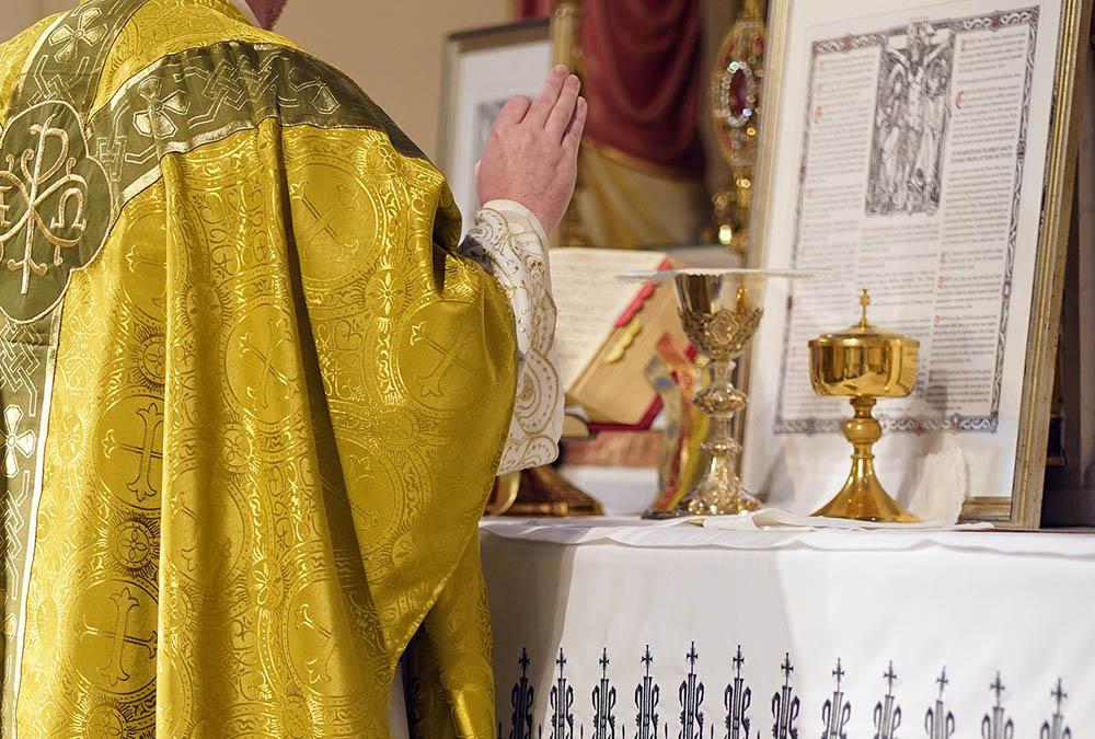 A priest prays during a traditional Latin Mass at St. Josaphat Church in the Queens borough of New York City. (CNS/Gregory A. Shemitz)
