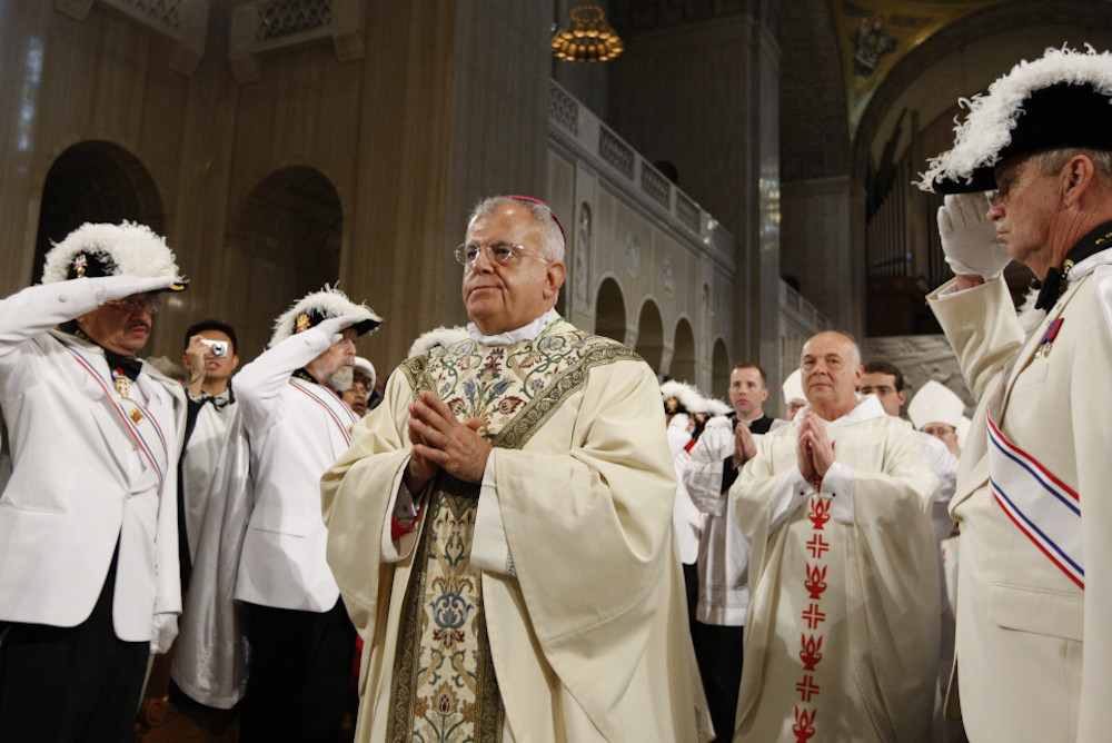 Knights of Columbus salute as Archbishop Augustine Di Noia, a U.S. Dominican, arrives for his episcopal ordination at the Basilica of the National Shrine of the Immaculate Conception in Washington July 11, 2009. (CNS/Paul Haring)