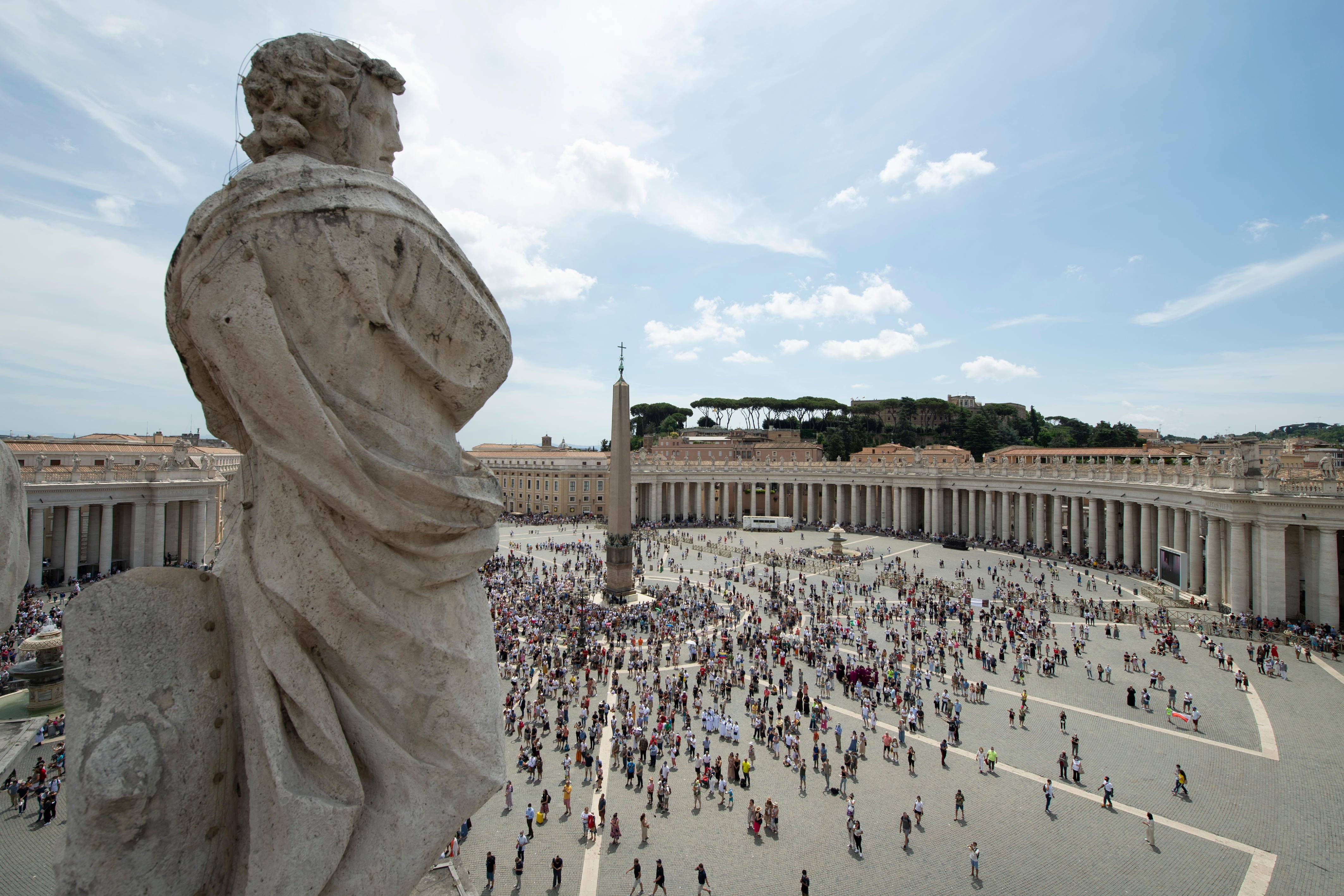 People gather in St. Peter's Square at the Vatican July 4, 2021, for the Angelus prayer with Pope Francis. The Vatican recently released the names of two commissions charged with assisting the leaders of the Synod of Bishops' general secretariat in review