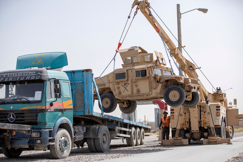 U.S. Army soldiers and contractors load a military vehicle for transport as U.S. forces prepare for withdrawal, in Kandahar, Afghanistan, July 13, 2020. (CNS/U.S. Army Sgt. Jeffery J. Harris handout vis Reuters)