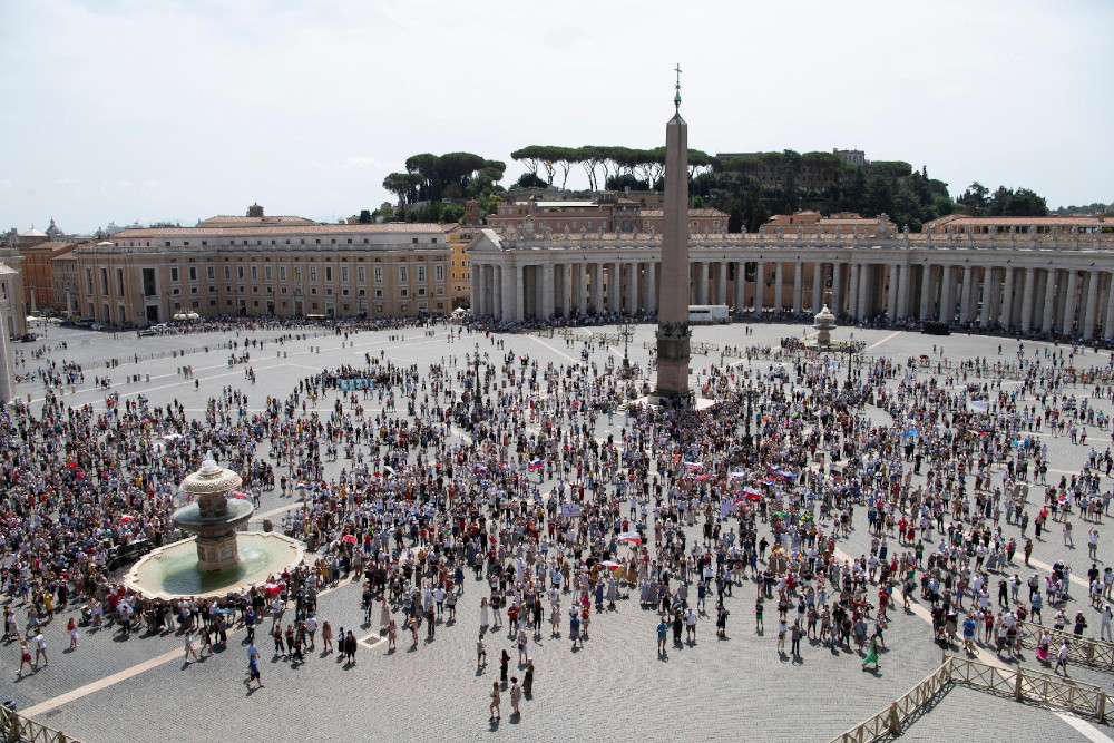 The crowd watches as Pope Francis leads the Angelus message from the window of his studio overlooking St. Peter's Square at the Vatican Aug. 1. (CNS/Vatican Media)