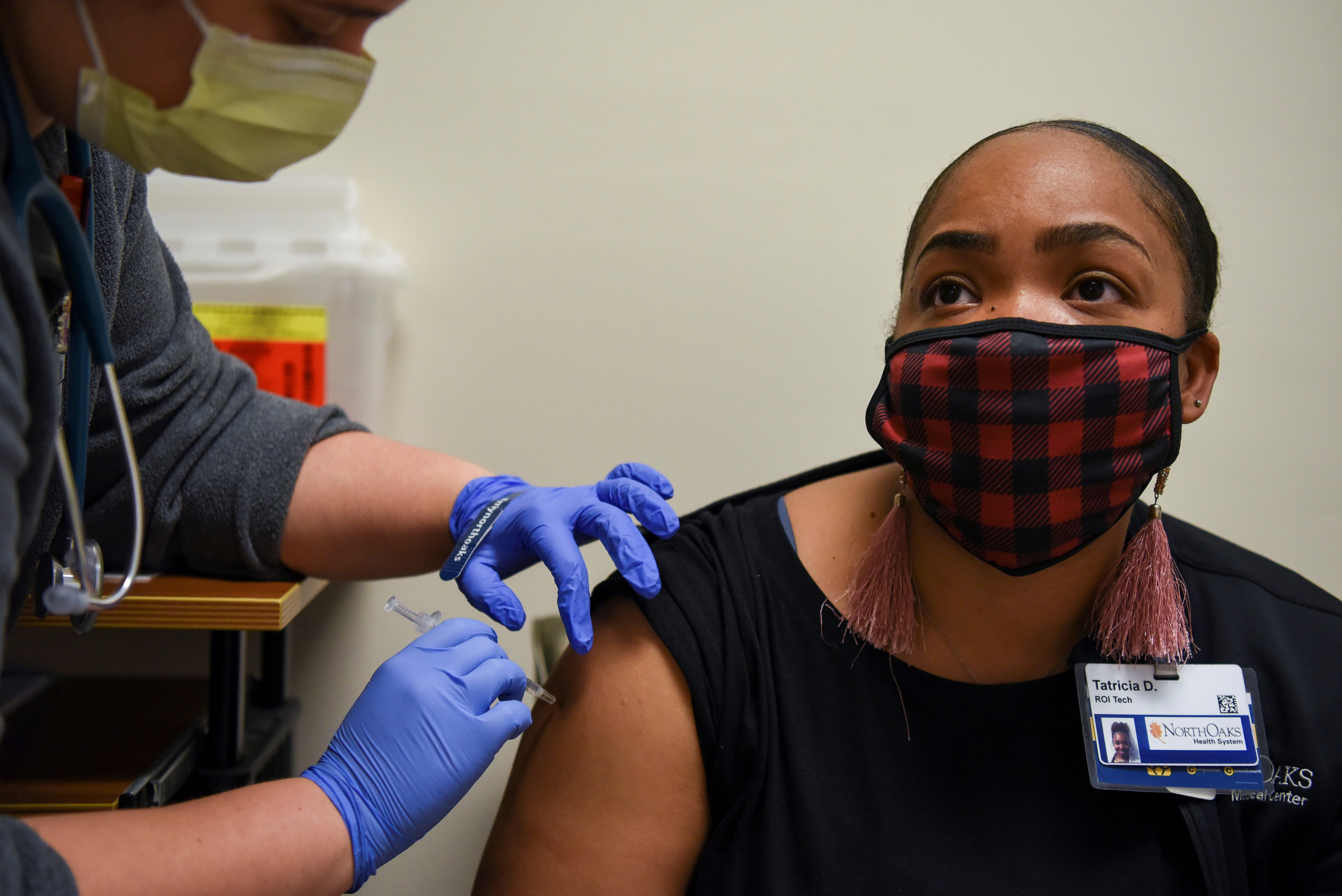 A woman receives a COVID-19 vaccine at North Oaks Medical Center in Hammond, La., Aug. 5, 2021. Results of a new poll released Aug. 5 showed many parents are hesitant about COVID-19 vaccines for their children. (CNS photo/Callaghan O'Hare, Reuters)