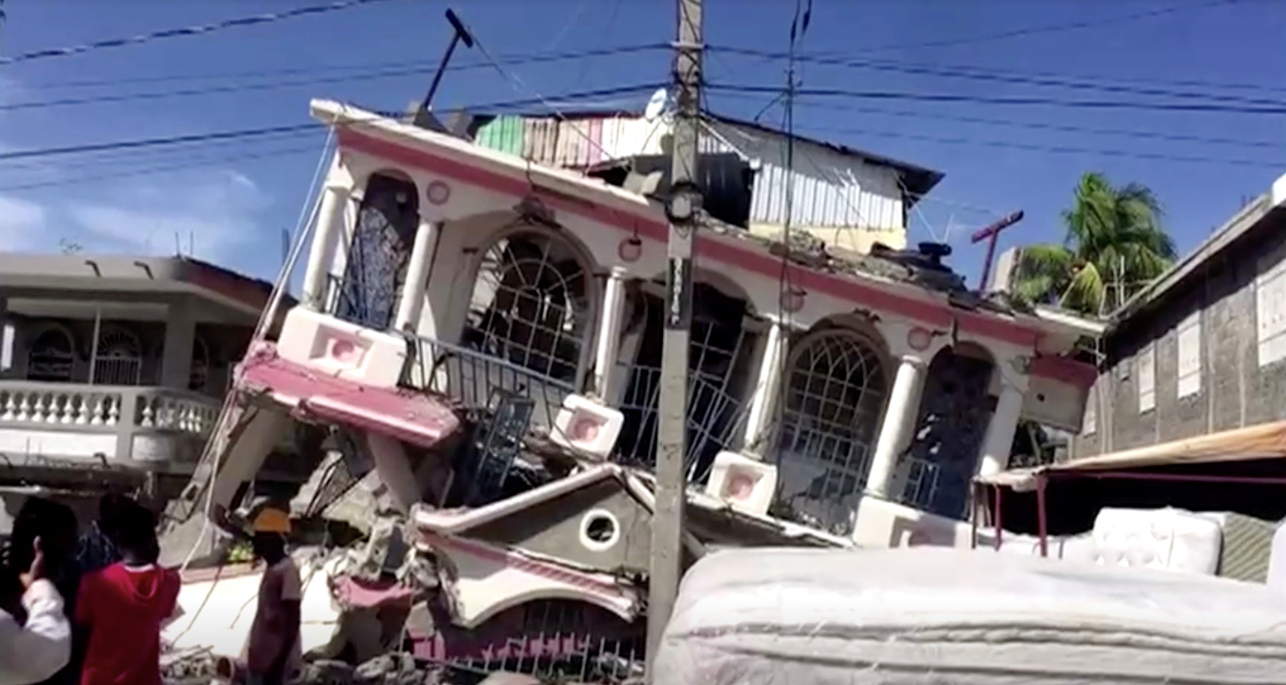 A collapsed building is pictured following a magnitude 7.2 earthquake in Les Cayes, Haiti, in this still image taken from a video Aug. 14, 2021. (CNS photo/Reuters TV)
