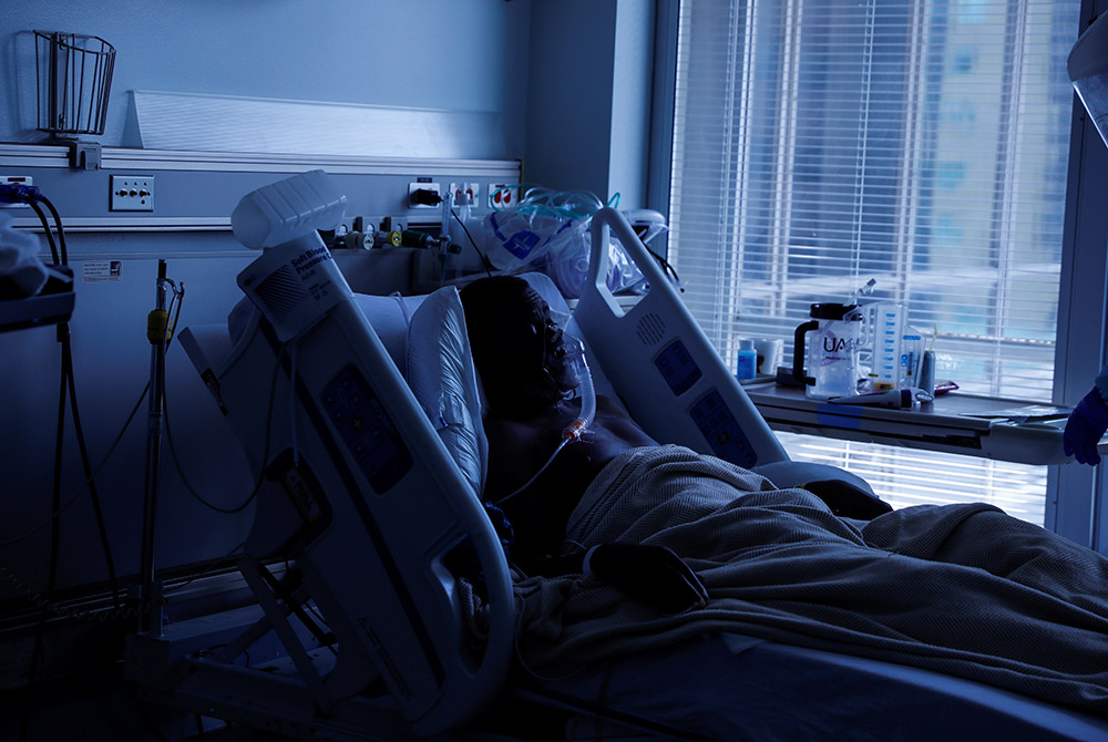 A COVID-19 patient in Little Rock, Arkansas, lays in his isolation room A COVID-19 patient in Little Rock, Arkansas, lays in his isolation room in the COVID-19 unit Aug. 16 at the University of Arkansas for Medical Sciences. (CNS/Reuters/Shannon Stapleton)