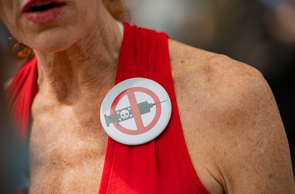 A woman outside New York City Hall in Manhattan is seen during a protest against mandating COVID-19 vaccines Aug. 16. (CNS/Reuters/Jeenah Moon)