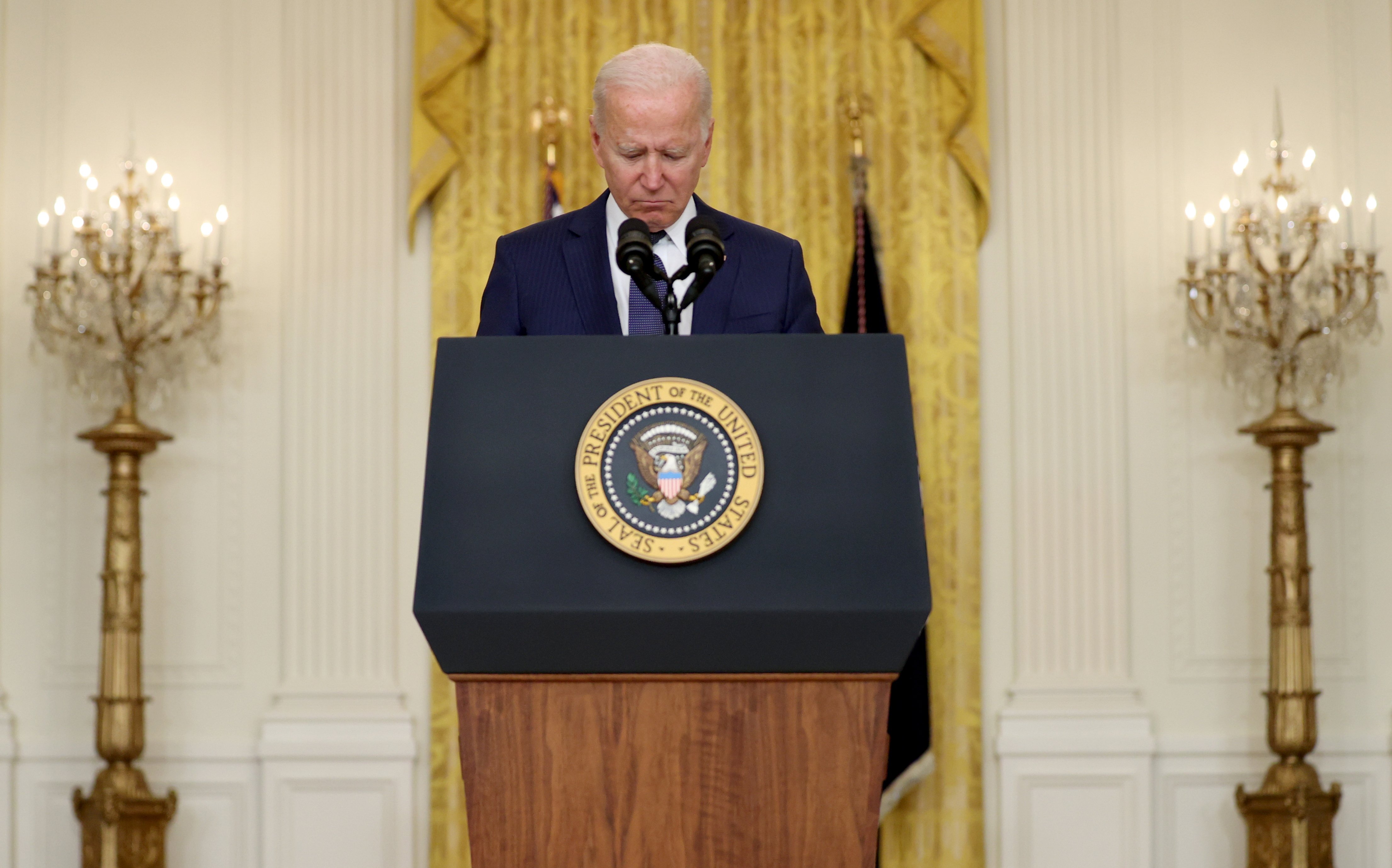President Joe Biden reacts Aug. 26 during a moment of silence for those who died in twin explosions at the airport in Kabul, Afghanistan, as he delivers remarks about the ongoing chaos in that country at the White House in Washington. (CNS/Reuters/Jonatha