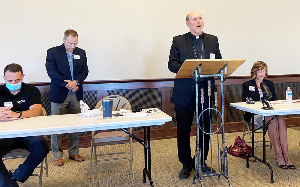Bishop Thomas Zinkula of Davenport, Iowa, prays at St. Patrick Catholic Church in Iowa City Aug. 24, at the start of a dialogue with Iowa business leaders about climate and clean energy. (CNS/The Catholic Messenger/Barb Arland-Fye)