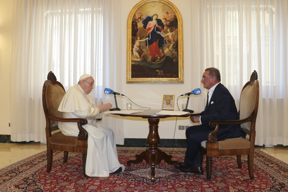 Pope Francis speaks during an interview with Carlos Herrera of COPE, the radio network owned by the Spanish bishops' conference, at the Vatican in late August. (CNS/Courtesy of COPE)