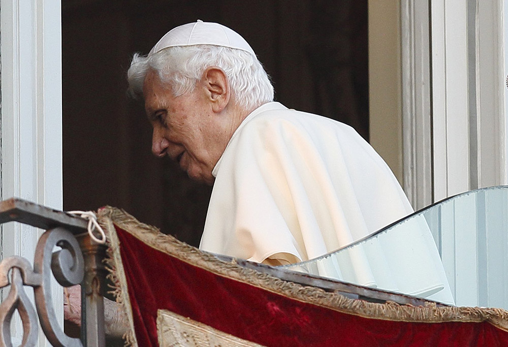 Pope Benedict XVI walks away after his final public appearance as pope in Castel Gandolfo, Italy, Feb. 28, 2013. (CNS/Paul Haring)