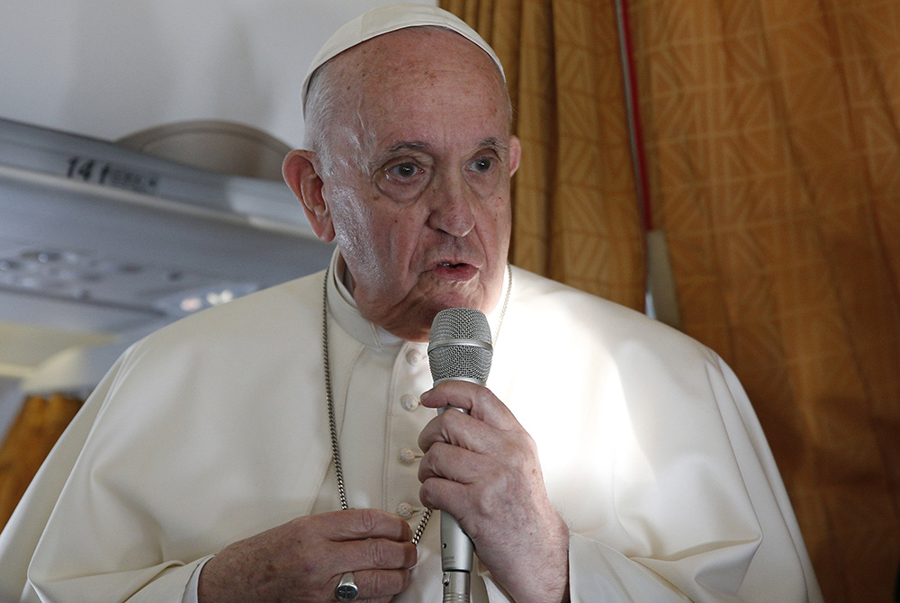 Pope Francis answers questions from journalists aboard his flight Sept. 15 from Bratislava, Slovakia, to Rome Pope Francis answers questions from journalists aboard his flight Sept. 15 from Bratislava, Slovakia, to Rome. (CNS/Paul Haring)