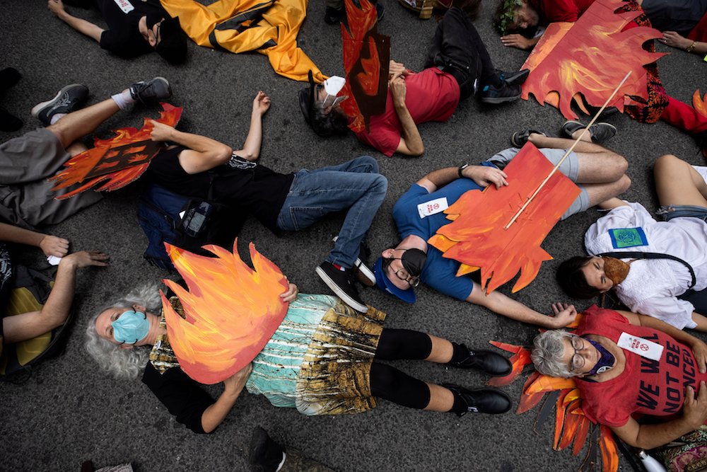People in New York City block a street in Manhattan pretending to be dead during a Sept. 17 climate change protest. (CNS photo/Caitlin Ochs, Reuters)