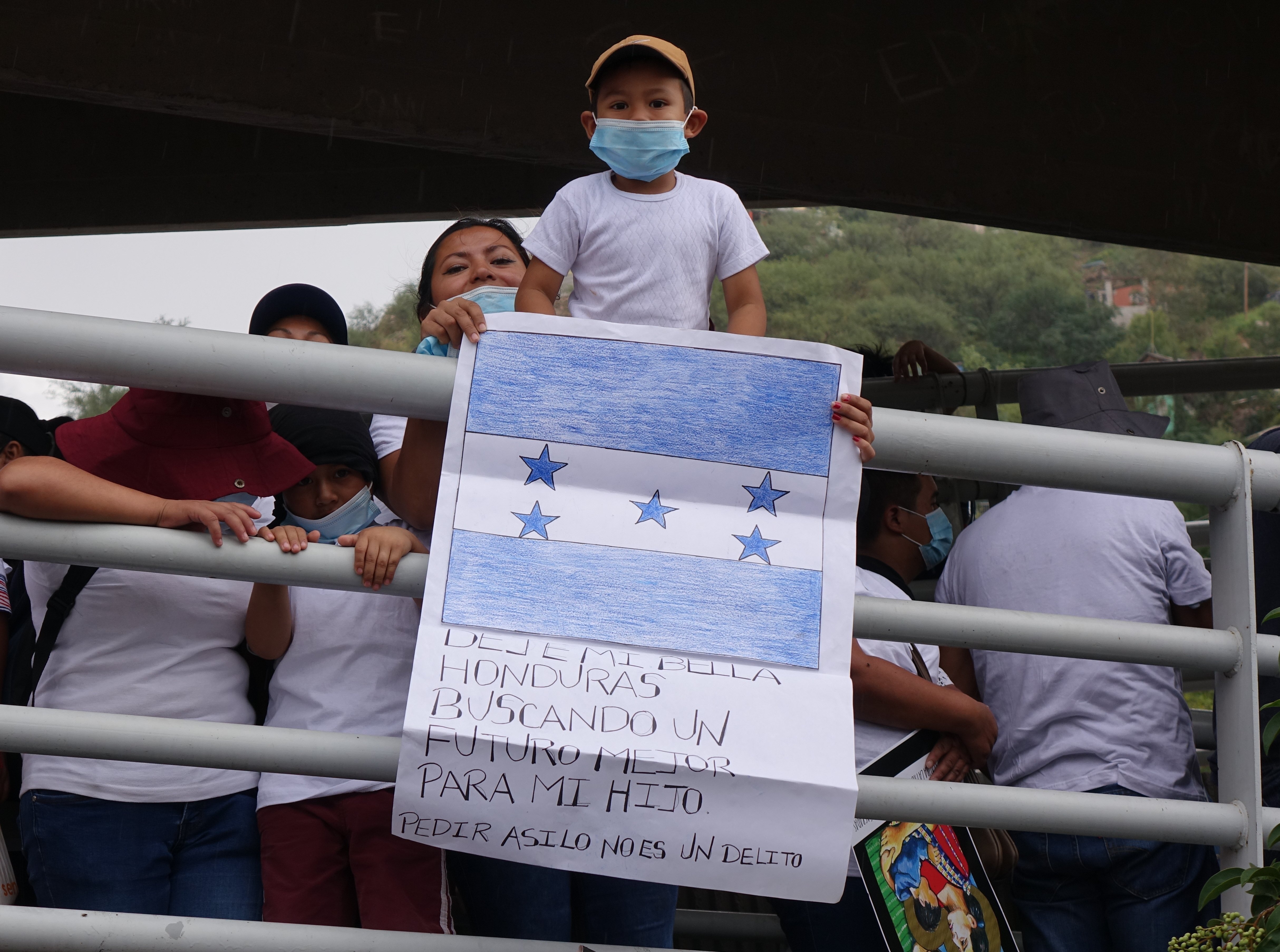 A Honduran boy and his mother are seen prior to the start of the "Restore Protections for Holy Families: Prophetic Action to #SaveAsylum" demonstration in Nogales, Mexico, Sept. 25, 2021. (CNS photo/courtesy Ignatian Solidarity Network)