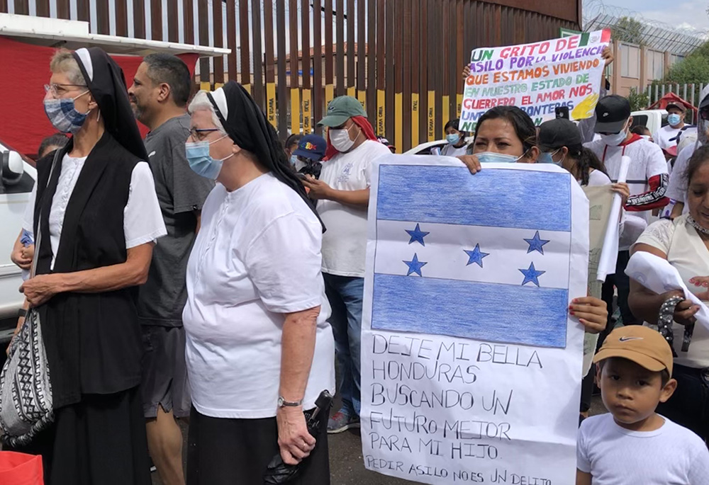 Women religious walk with migrants during the "Restore Protections for Holy Families: Prophetic Action to #SaveAsylum" demonstration in Nogales, Mexico, Sept. 25, 2021. (CNS/Courtesy of Ignatian Solidarity Network)