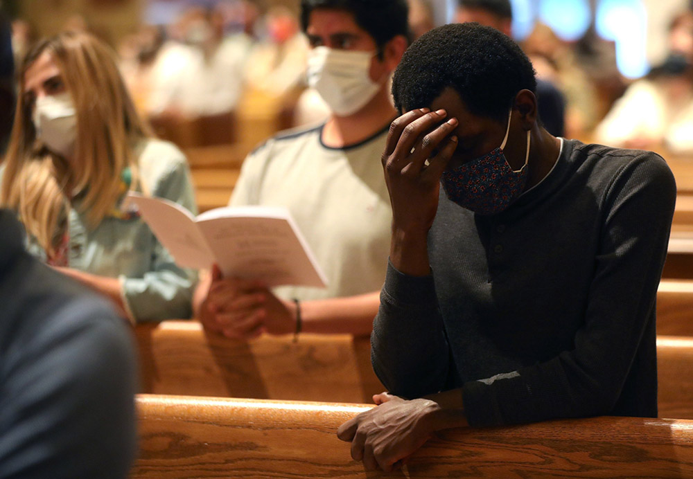 People in Washington pray during a World Day for Migrants and Refugees Mass at the Cathedral of St. Matthew the Apostle Sept. 26. (CNS/Catholic Standard/Andrew Biraj)