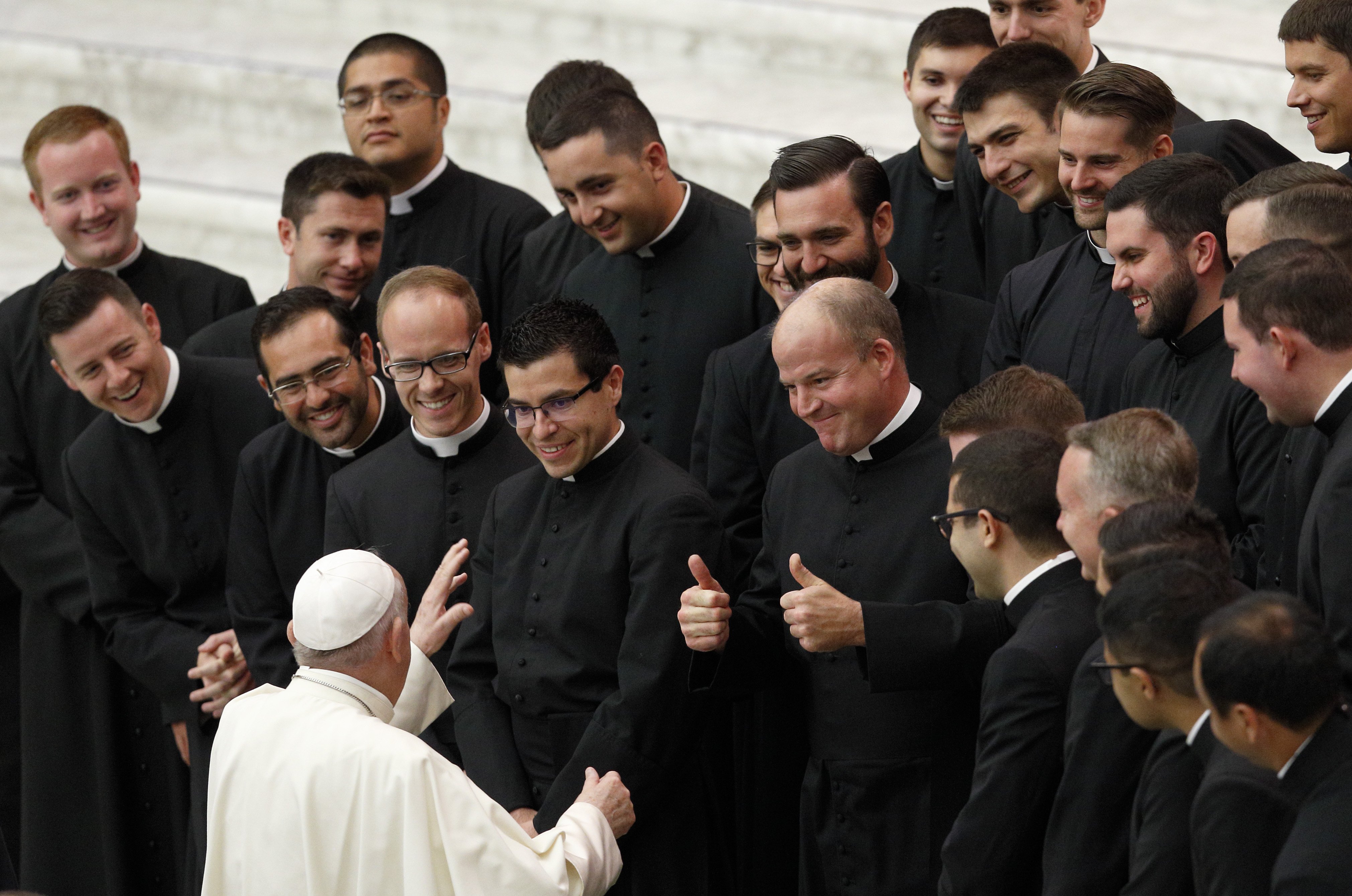 Pope Francis greets seminarians from the Pontifical North American College during his general audience in the Paul VI hall at the Vatican Sept. 29, 2021. Father Peter Harman, rector of the U.S. seminary, is seen giving a thumbs up. (CNS photo/Paul Haring)