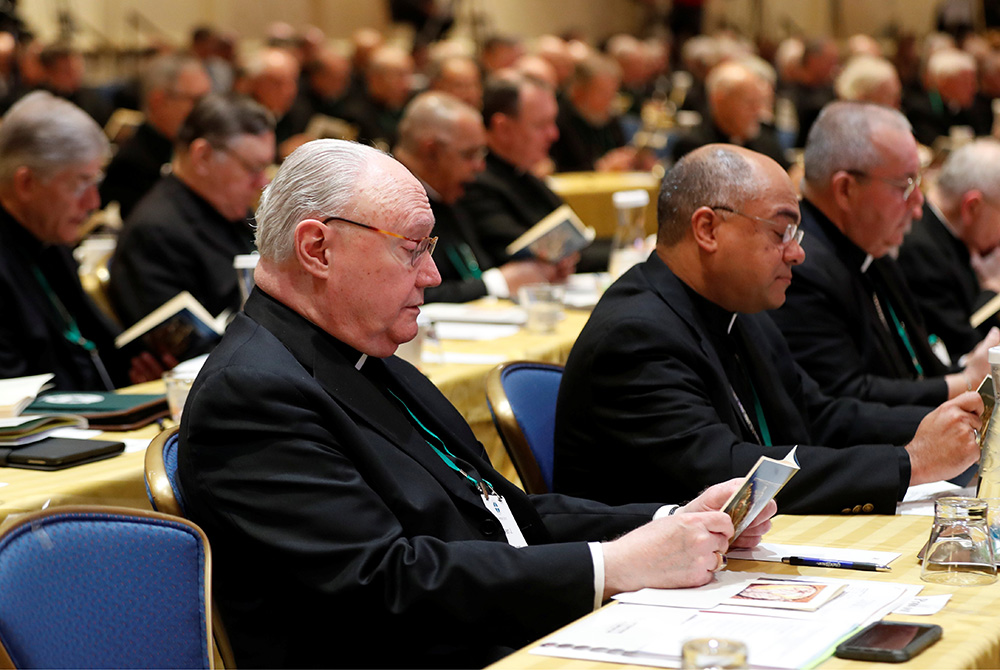 Several bishops pray during a Nov. 12, 2018, session of the U.S. Conference of Catholic Bishops' fall general assembly in Baltimore. The bishops' 2021 plenary meeting will be the first time they have met in person since the pandemic began. (CNS)