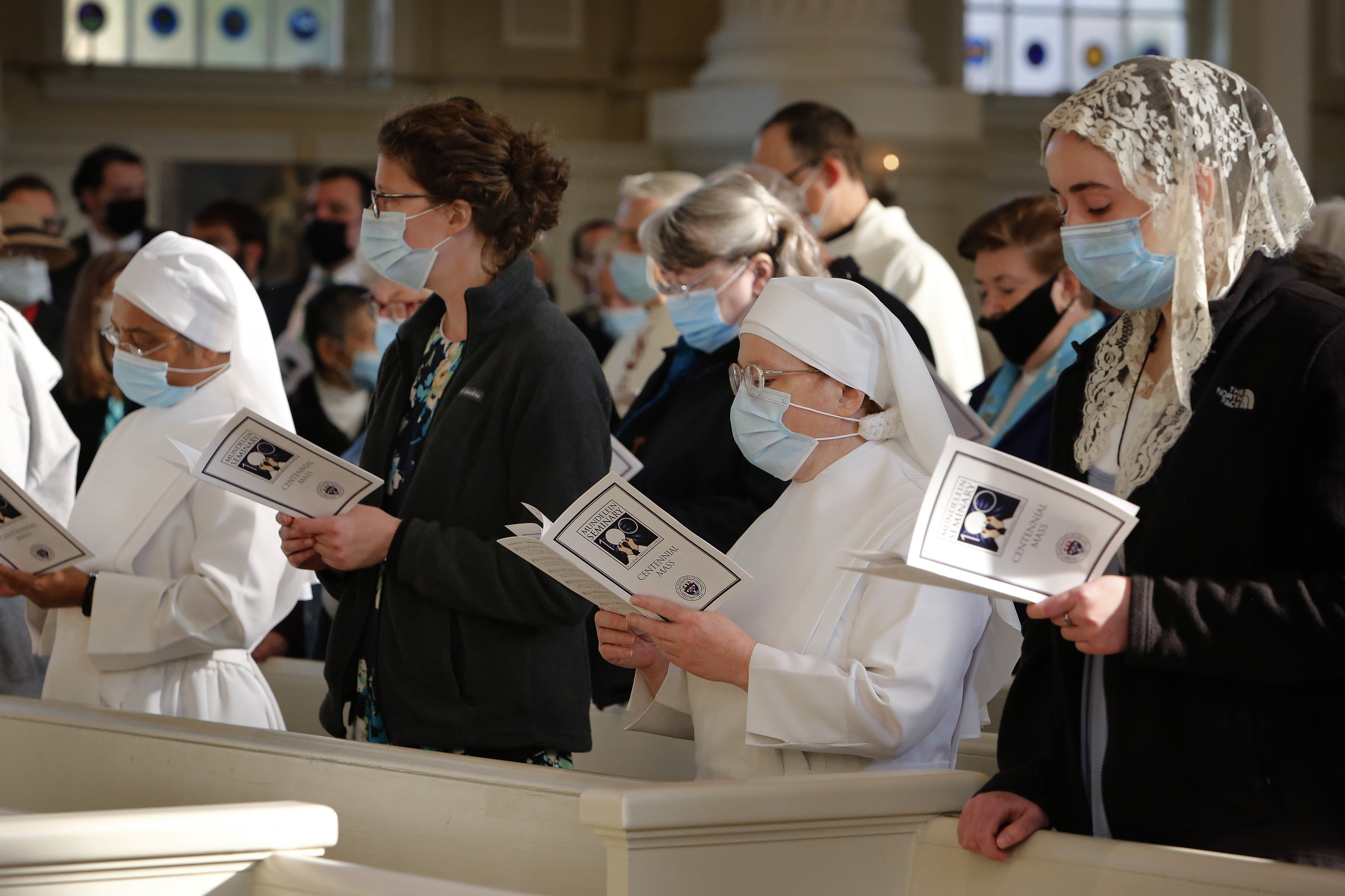 Guests including Little Sisters of the Poor sing during the entrance procession of Mass in the Chapel of the Immaculate Conception at Mundelein Seminary Oct. 17, 2021. (CNS photo/Karen Callaway, Chicago Catholic)