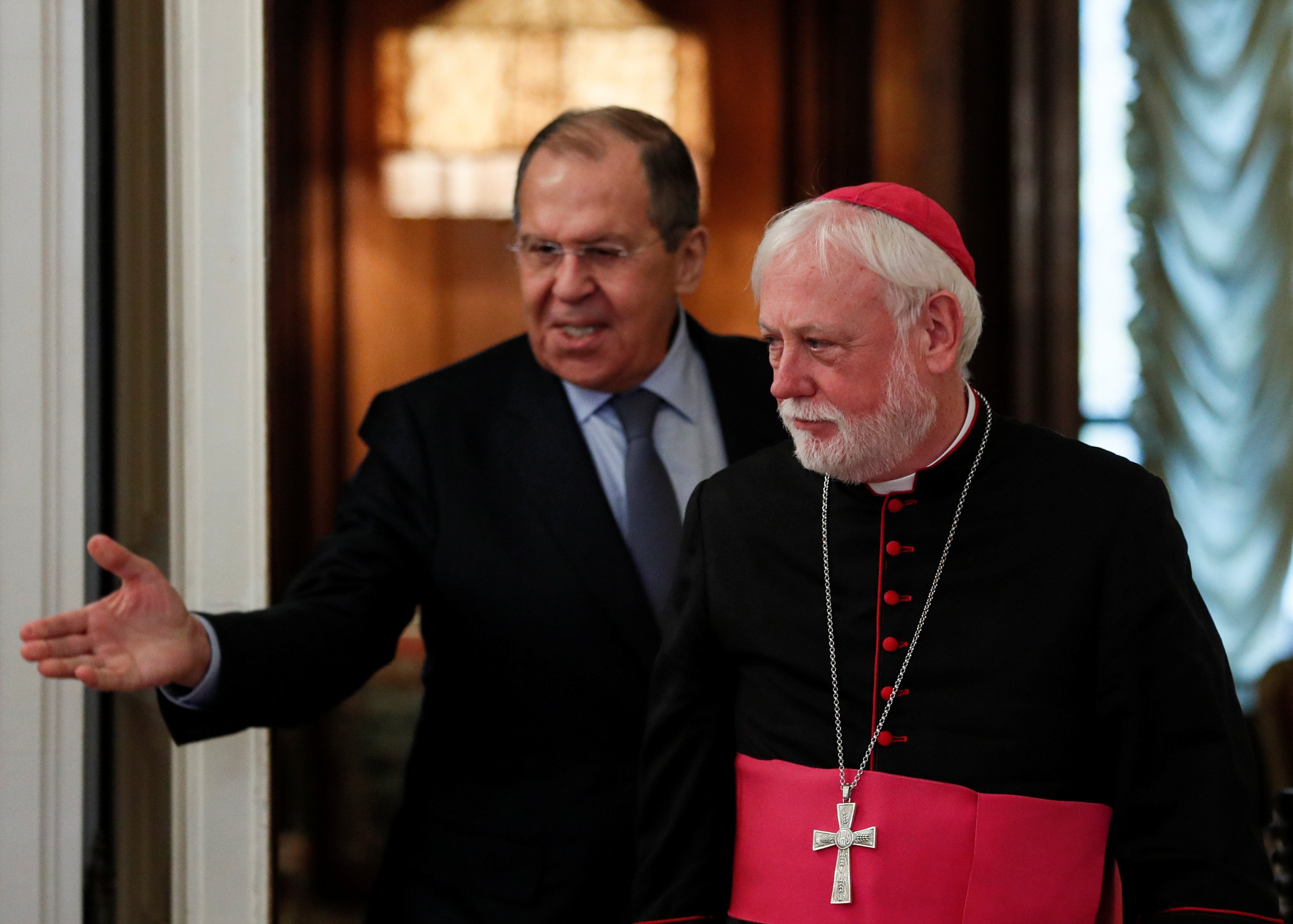 Russian Foreign Minister Sergei Lavrov enters a hall with Archbishop Paul Gallagher, Vatican secretary for relations with states, during their meeting in Moscow Nov. 9, 2021. (CNS photo/Yuri Kochetkov, pool via Reuters)