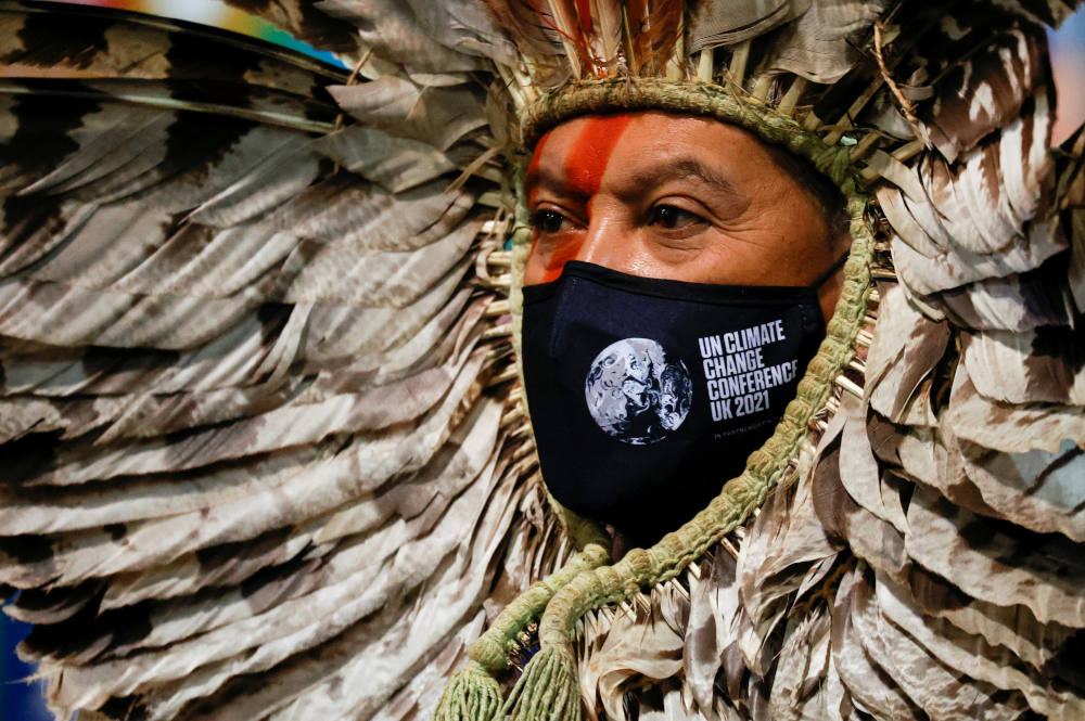 Indigenous Amazon delegate Romancil Gentil Kreta, wearing a protective mask with a logo of the U.N. Climate Change Conference, looks on during the conference in Glasgow, Scotland, Nov. 3, 2021. (CNS photo/Phil Noble, Reuters)