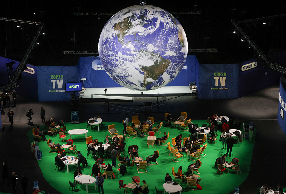 People attend the U.N. Climate Change Conference in Glasgow, Scotland, Nov. 12. (CNS/Reuters/Yves Herman)