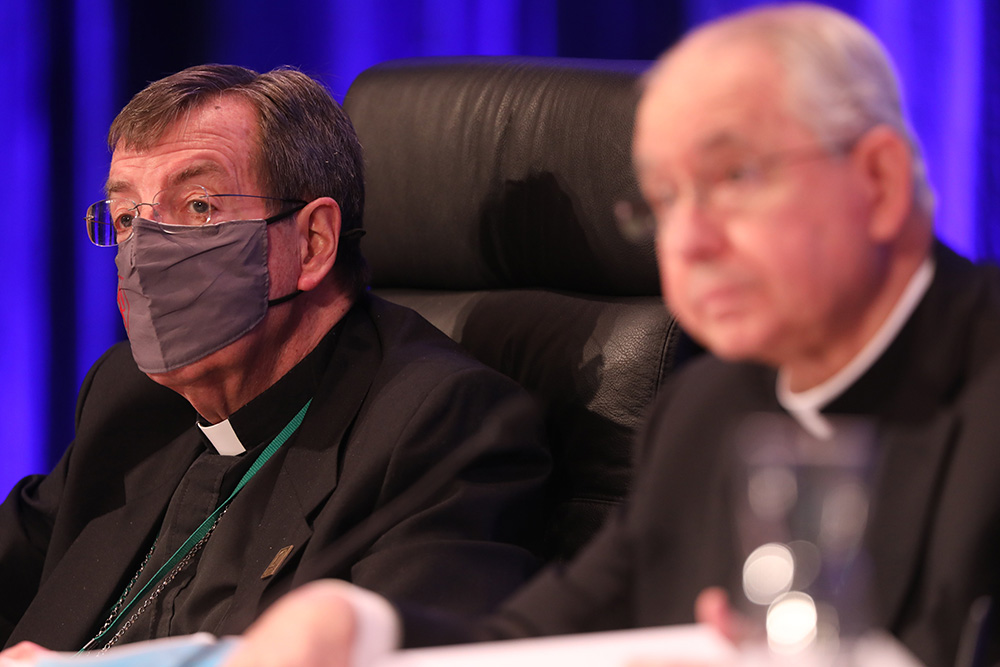 Detroit Archbishop Allen Vigneron, vice president of the U.S. Conference of Catholic Bishops, and Los Angeles Archbishop José Gomez, president, listen to a question during a Nov. 17 session of the bishops' fall general assembly in Baltimore. (CNS)