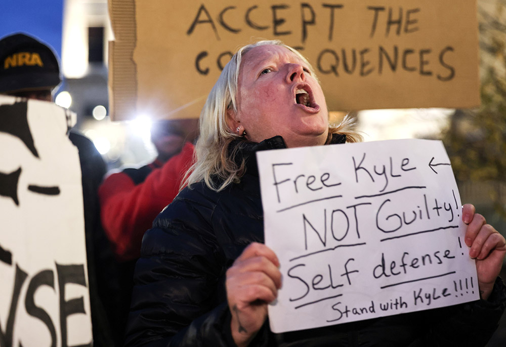 Protesters in Kenosha, Wisconsin, demonstrate outside the Kenosha County Courthouse Nov. 15, during the trial of Kyle Rittenhouse. (CNS/Reuters/Evelyn Hockstein)