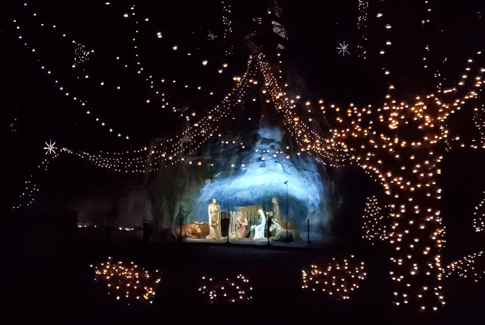 A Nativity scene is created inside Lourdes Grotto as part of the annual Way of Lights Christmas display at the National Shrine of Our Lady of the Snows, in Belleville, Illinois. (NCR/Brian Roewe)