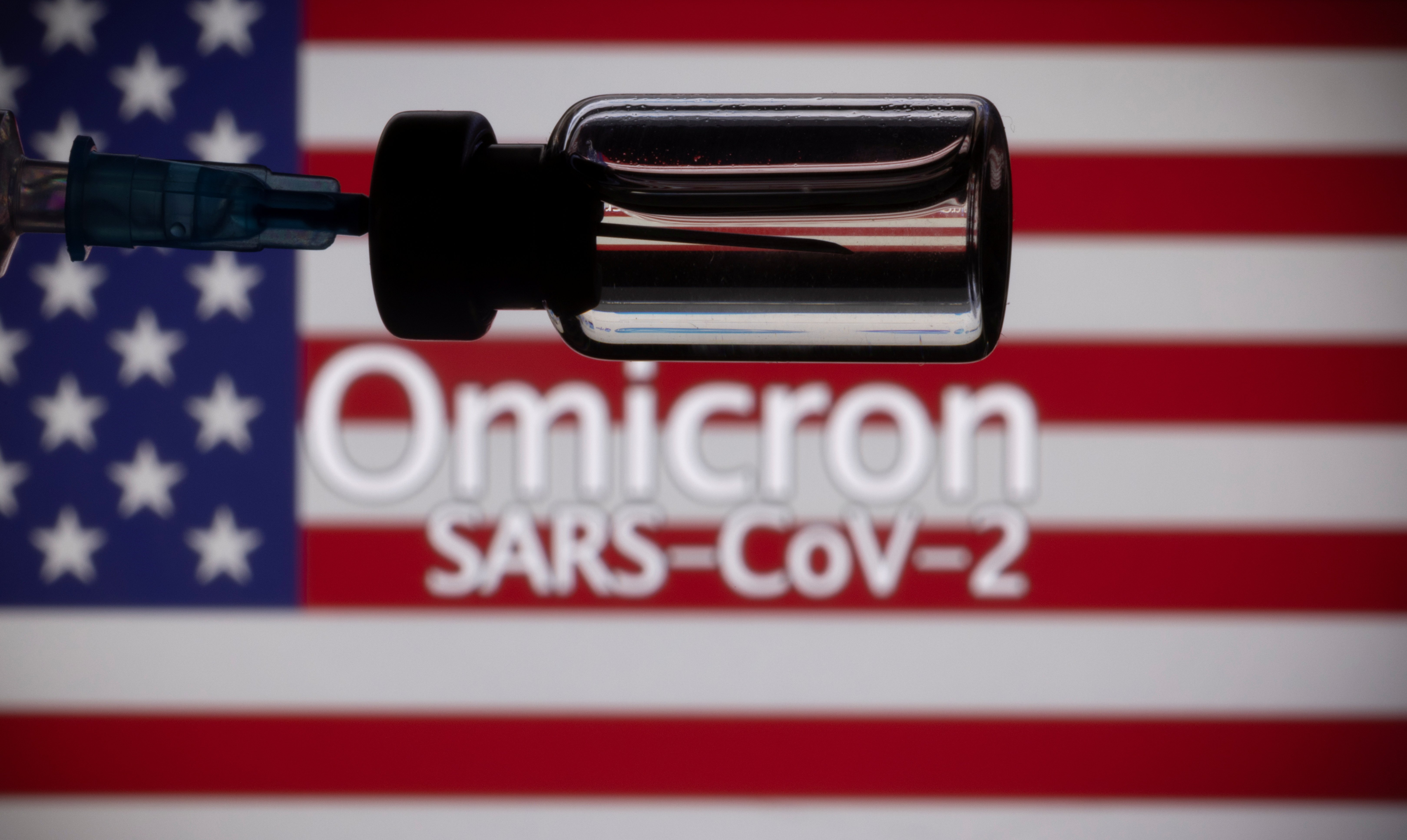 A vial, syringe and U.S. flag are seen in this illustration about a new variant of the coronavirus the medical world has labeled "Omicron." (CNS photo/Dado Ruvic, Reuters)