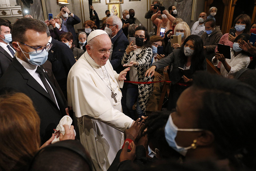 Pope Francis greets people as he leaves an ecumenical prayer with migrants in the Church of the Holy Cross Dec. 3 in Nicosia, Cyprus, Dec. 3. (CNS/Paul Haring) Pope Francis greets people as he leaves an ecumenical prayer with migrants in the Church of the Holy Cross Dec. 3 in Nicosia, Cyprus, Dec. 3. (CNS/Paul Haring)
