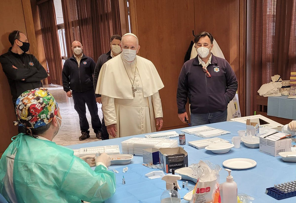 Pope Francis visits a COVID-19 vaccination clinic in the Paul VI hall April 2 at the Vatican. Throughout the year, the pope continued to encourage vaccination against COVID-19. (CNS/Holy See Press Office)