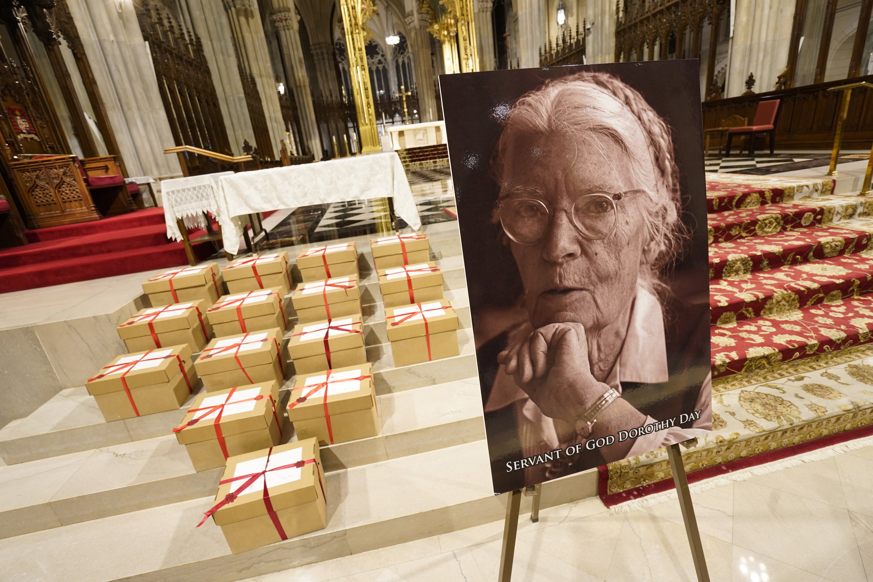 Sealed archival boxes containing documents related to Dorothy Day's canonization cause are seen in the sanctuary following a Mass Dec. 8, 2021, at St. Patrick's Cathedral in New York City. (CNS photo/Gregory A. Shemitz)