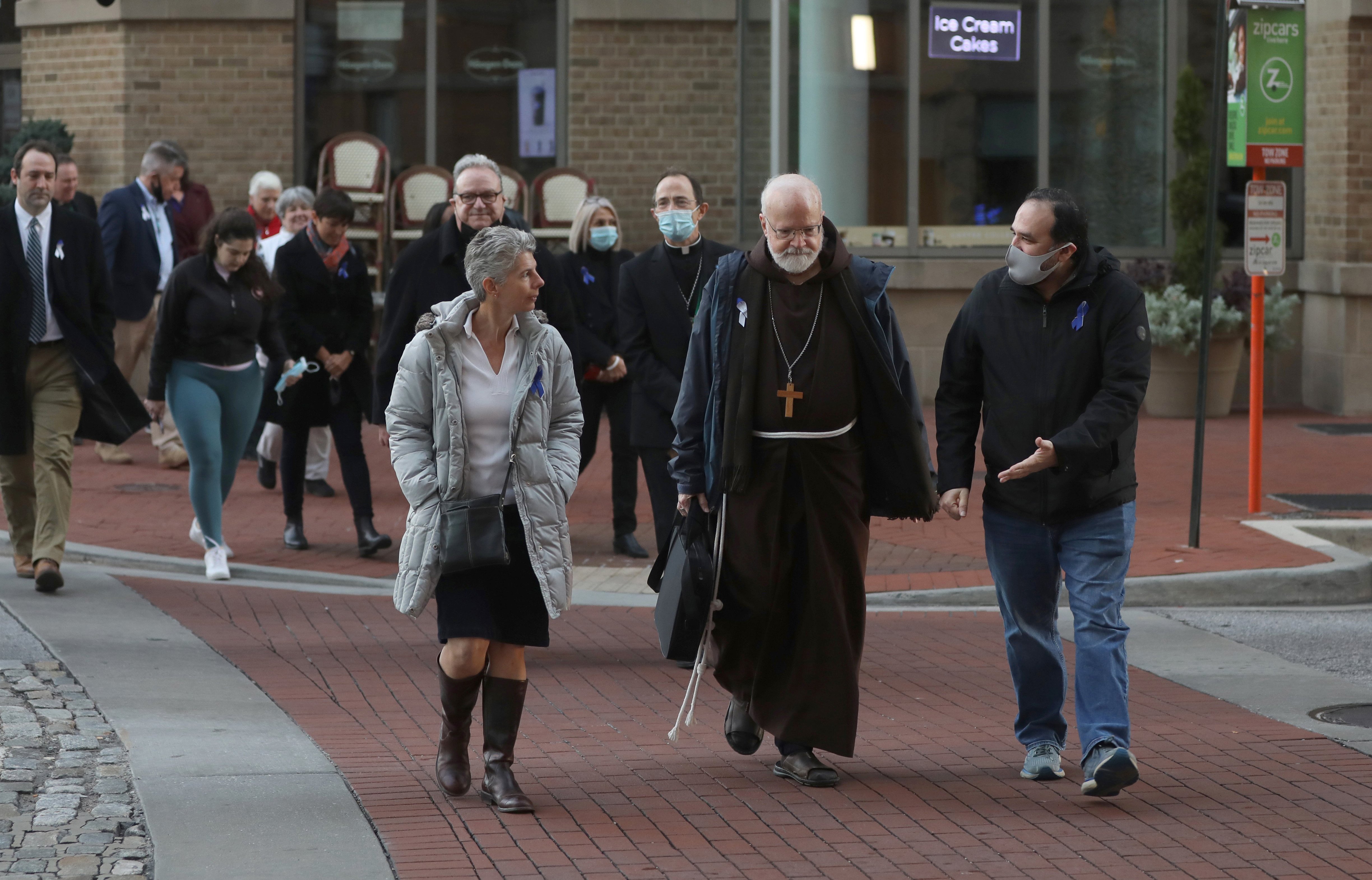 Cardinal Sean P. O'Malley of Boston, president of the Pontifical Commission for the Protection of Minors, leads a sunrise walk to end abuse, in Baltimore, Nov. 18, 2021. (CNS photo/Bob Roller)