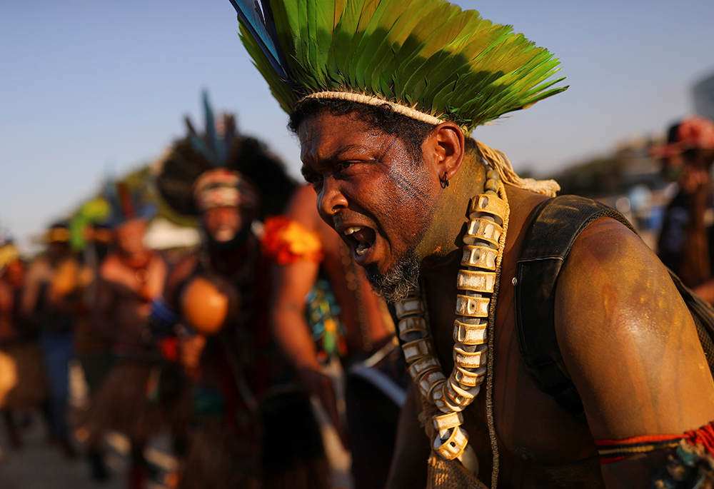 Indigenous people take part in a protest in Brasilia Aug. 25, 2021, the first day of Brazil's Supreme Court trial of a case on Indigenous land rights. (CNS/Reuters/Adriano Machado)