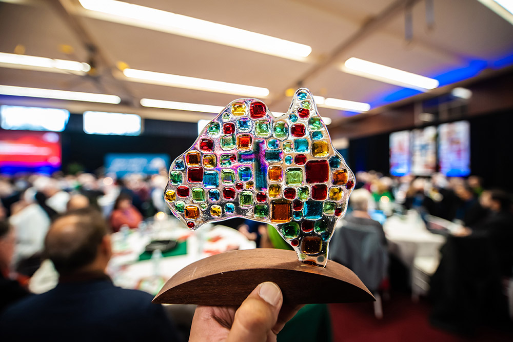 A person in Sydney holds a memento of the Plenary Council of Australia July 4. (CNS/The Catholic Weekly/Giovanni Portelli)