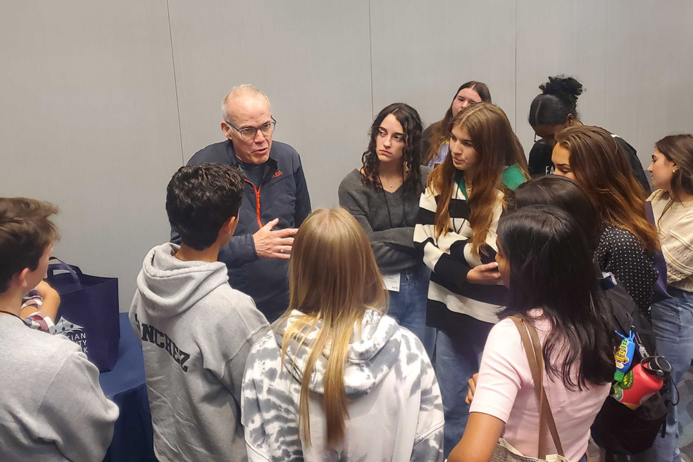 Environmental activist and writer Bill McKibben talks with attendees after a breakout session at the 25th annual Ignatian Family Teach-In for Justice on Oct. 22 in Washington, D.C. (EarthBeat photo/Brian Roewe)