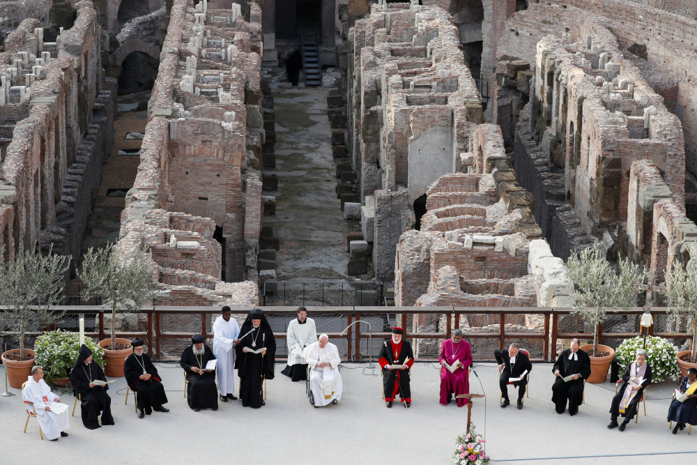Pope Francis presides over a prayer for peace with other Christian leaders inside Rome's Colosseum before joining other religious leaders launching an appeal for peace Oct. 25, 2022. (CNS photo/Remo Casilli, Reuters)