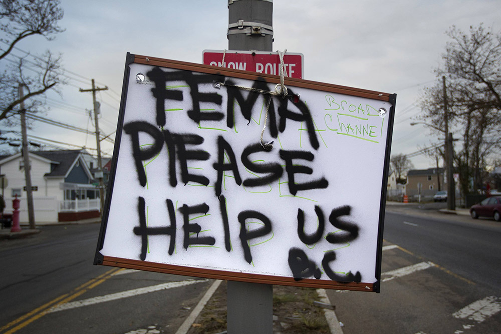 A sign asking for help from the Federal Emergency Management Agency, or FEMA, is seen in the Broad Channel section of the Queens borough of New York Nov. 2, 2012. (CNS/Reuters/Shannon Stapleton)
