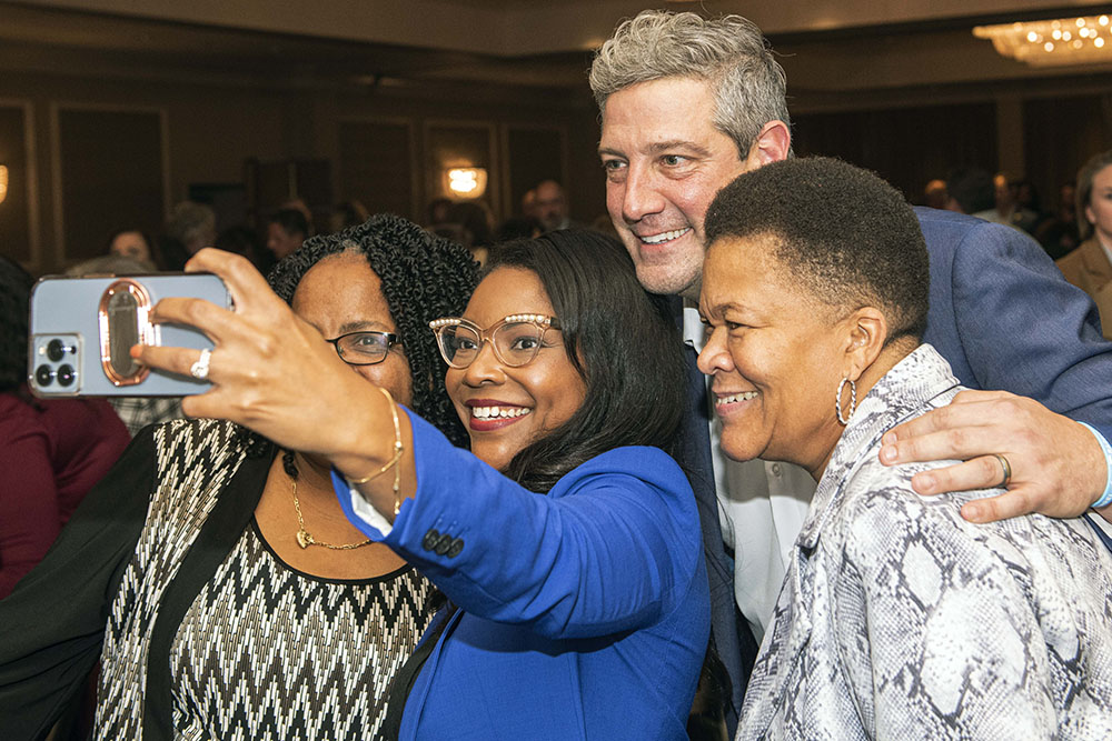 Rep. Tim Ryan, D-Ohio, takes a selfie with Gwen Johnson of Lyndhurst, Ohio (foreground), candidate for U.S. Congress Emilia Sykes of Akron (center), and Margie Chambers of Cleveland after his speech at the Tri-County Labor Council Community Awards Dinner in Fairlawn, Ohio, Oct. 21. (AP/Phil Long)