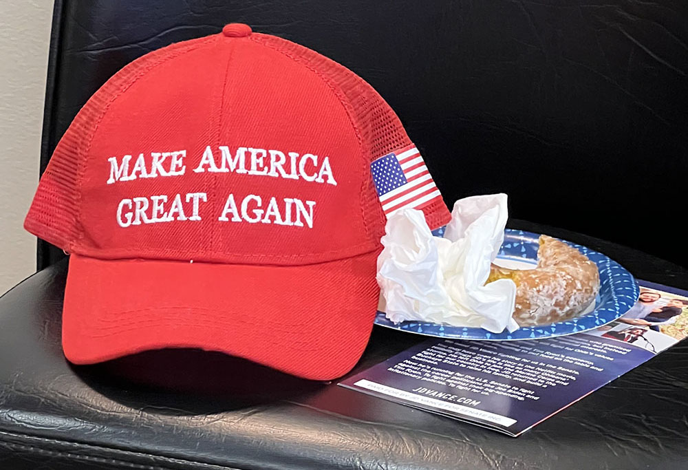 A voter left behind former President Donald Trump's signature Make America Great Again red baseball cap at a J.D. Vance campaign event Oct. 5 in Columbus, Ohio. (NCR photo/Brian Fraga)