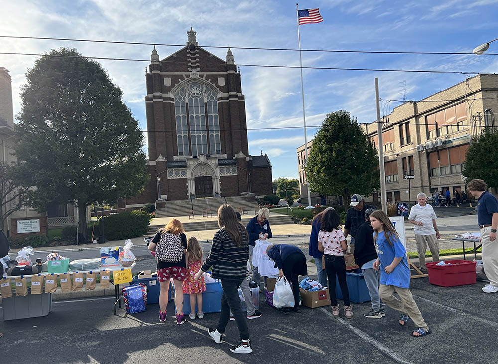 Area residents visit an open-air thrift goods sale across the street from St. Patrick Church in Youngstown, Ohio, on Oct. 6. (NCR photo/Brian Fraga)