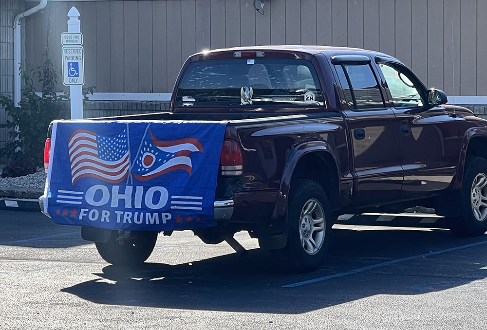 A pickup truck with an "Ohio for Trump" banner parked outside an Oct. 5 campaign event for U.S. Senate candidate J.D. Vance in Perrysburg, Ohio. (NCR photo/Brian Fraga)