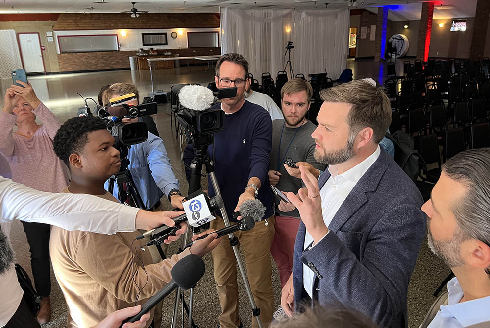 U.S. senate candidate J.D. Vance speaks to reporters Oct 5 in Perrysburg, Ohio, while Donald Trump Jr. looks on. (NCR photo/Brian Fraga)