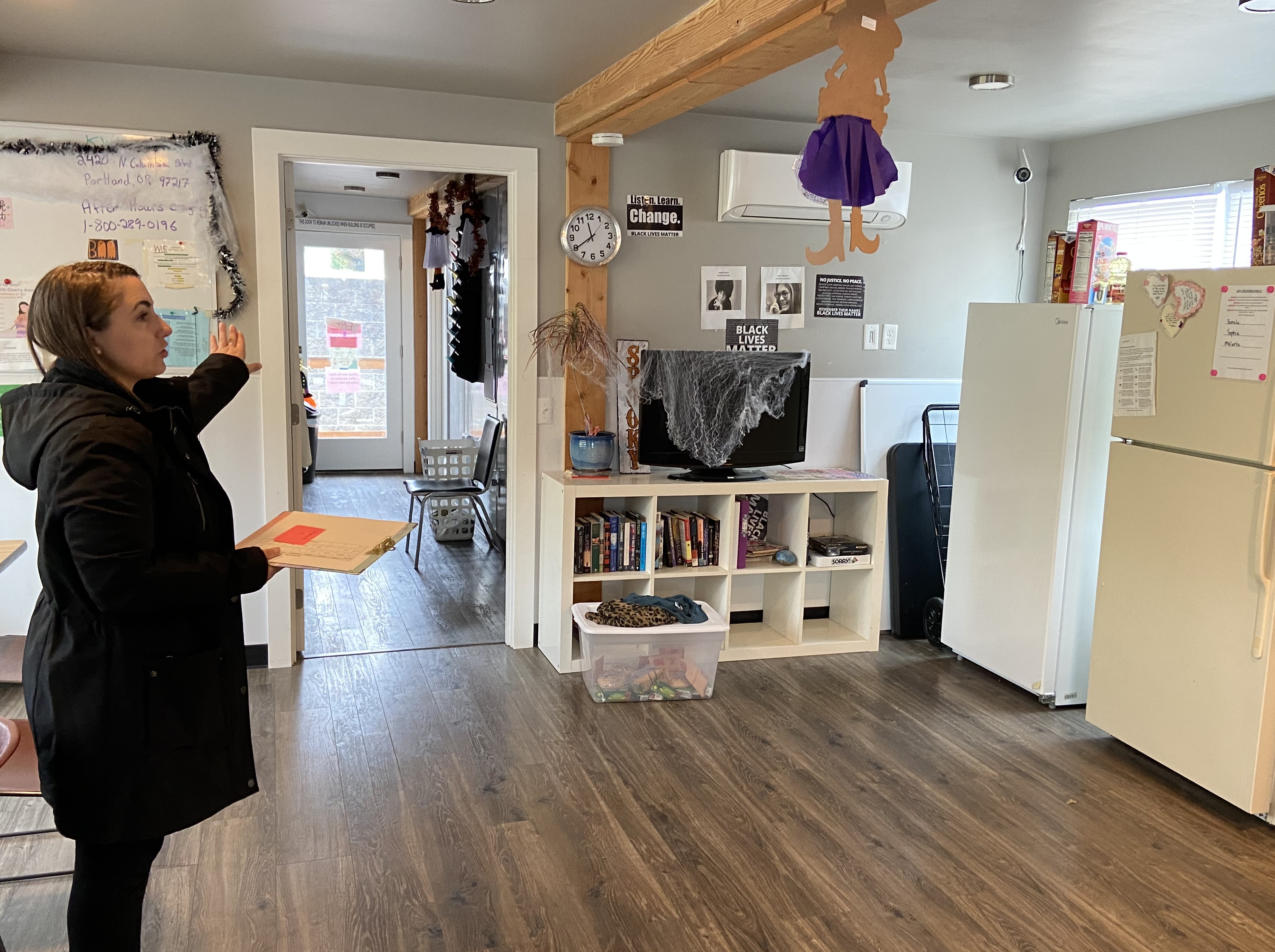 Woman gives tour of community kitchen